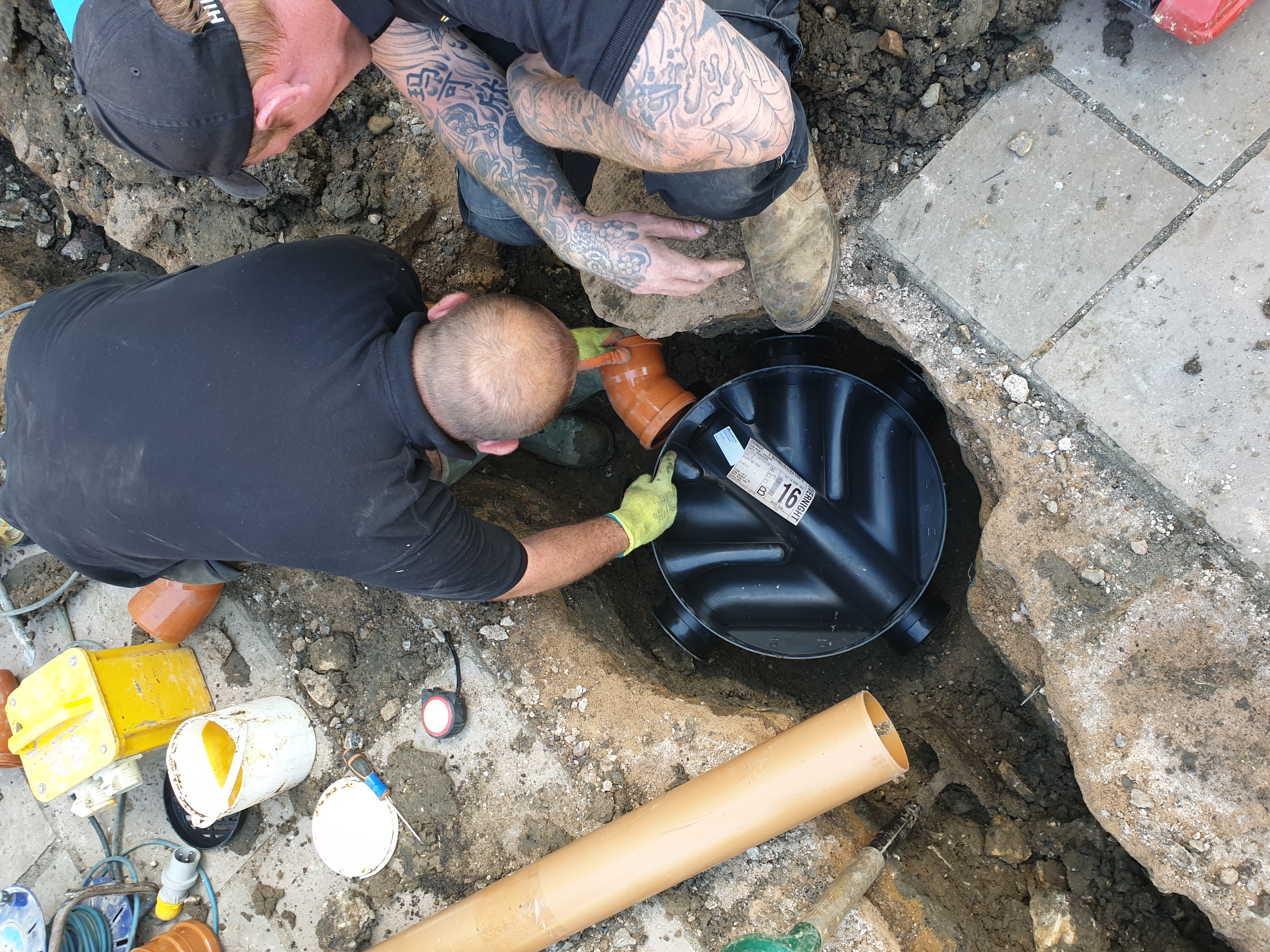 Allerton engineer installing a manhole