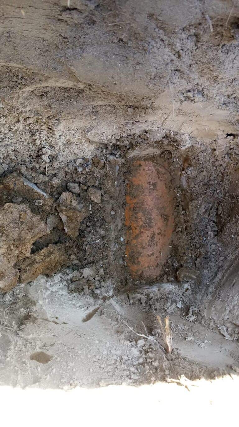 Original outlet pipe for the septic tank exposed