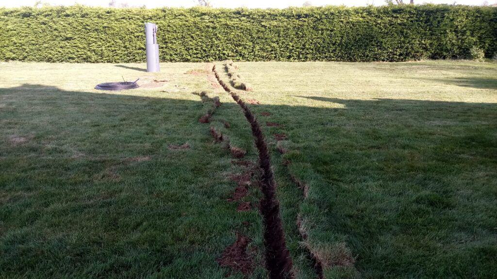 Turf removed for armored cable for the ConSept septic tank installation