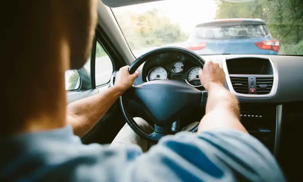 man in car