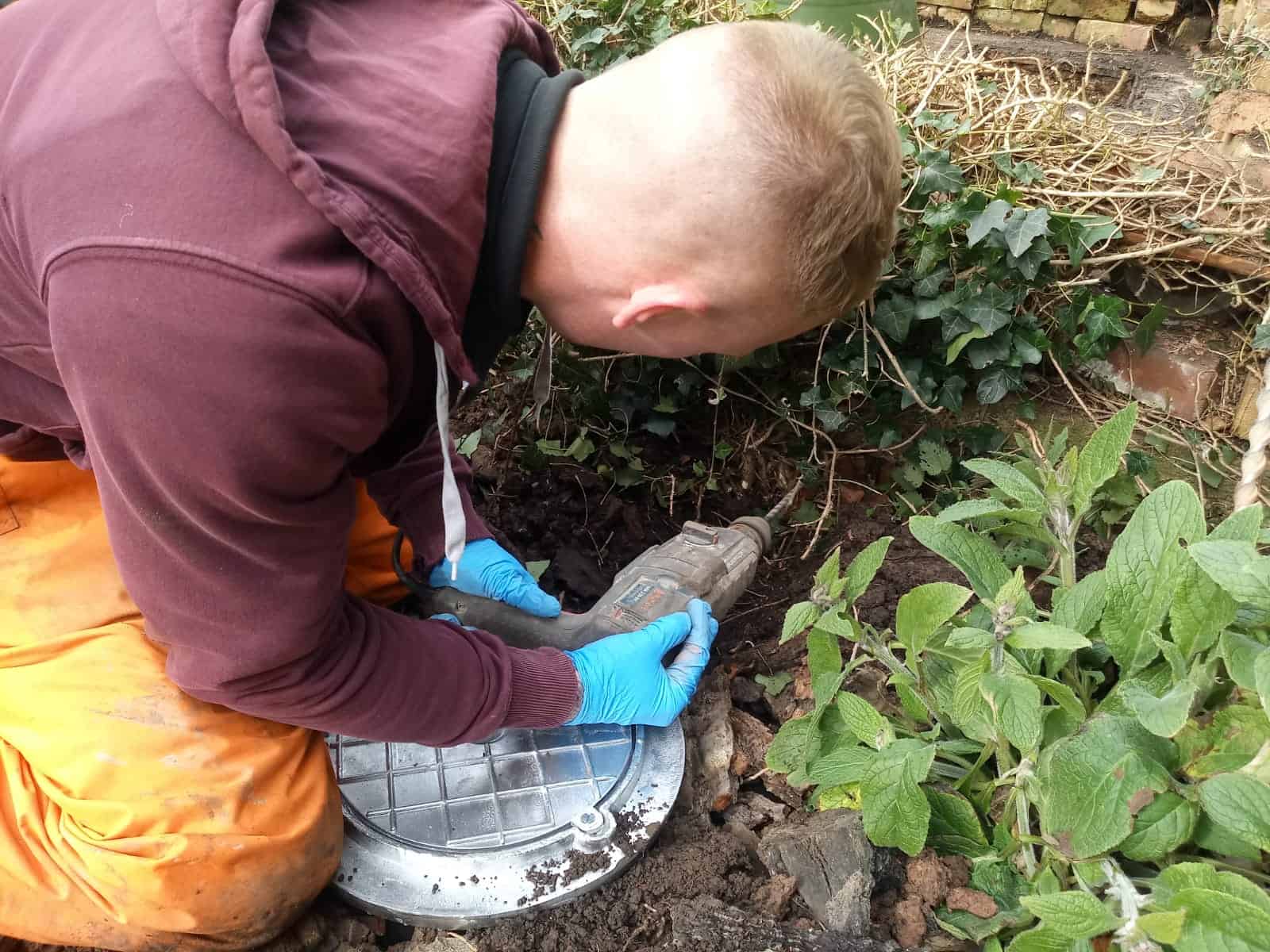 Miles Drilling a Hole in ConSept Pipe.