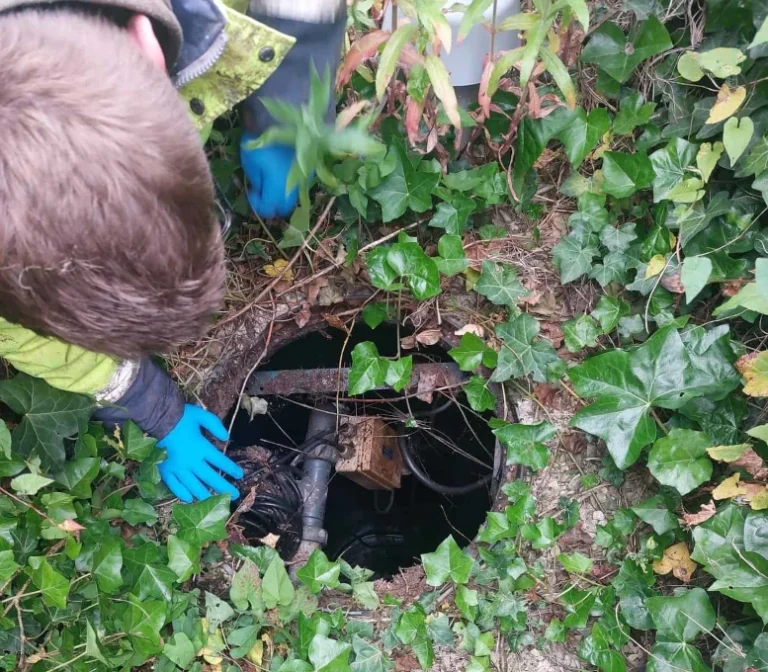 servicing engineer observing septic tank